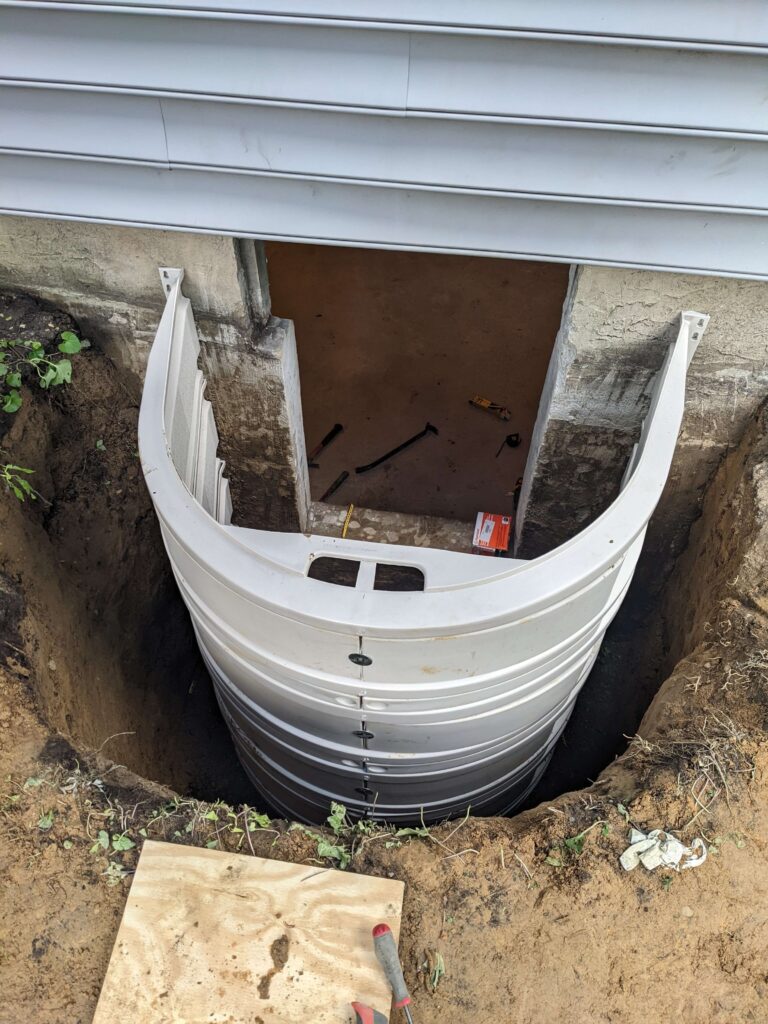 Basement Egress Window Being Installed in Long Island