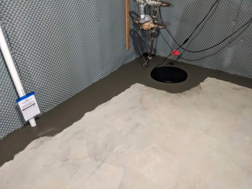 Full Wall Drainage mat with french drain installed in Long Island home