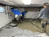 Long Island Basement Waterproofing Team Installing System