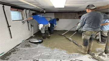 Long Island Basement Waterproofing Team Installing System