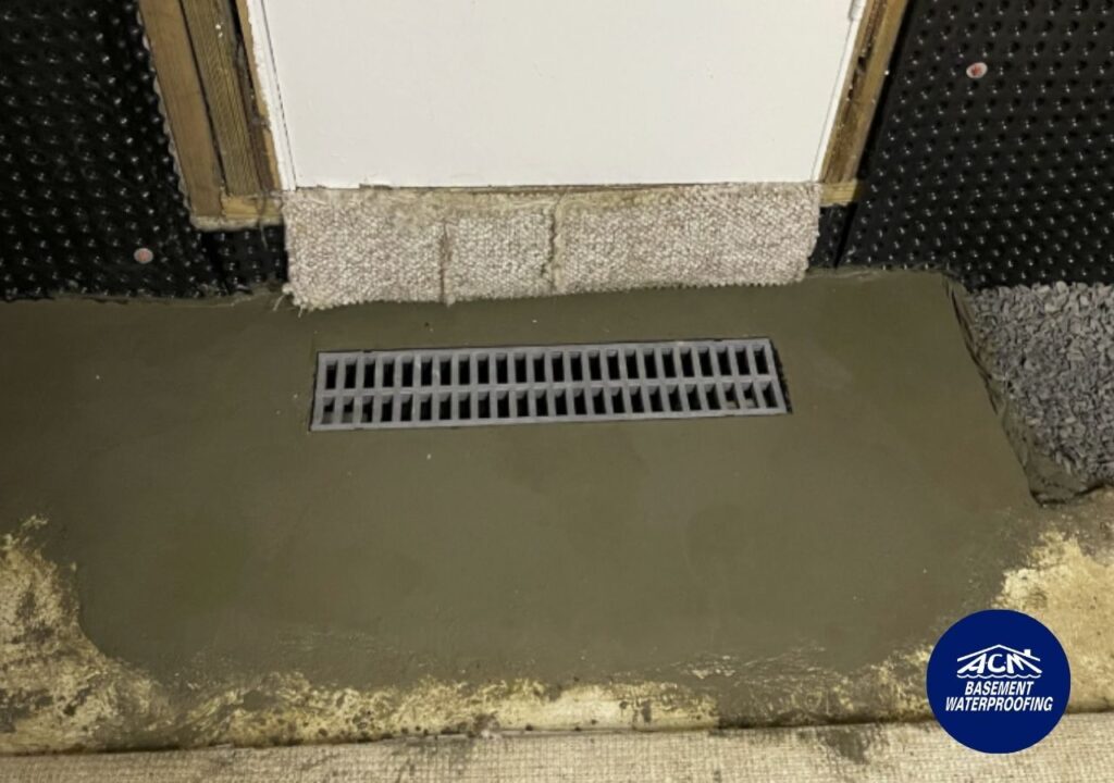 Trench drain at foot of basement entrance, basement waterproofing